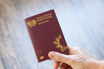 Hand holding Portuguese passport