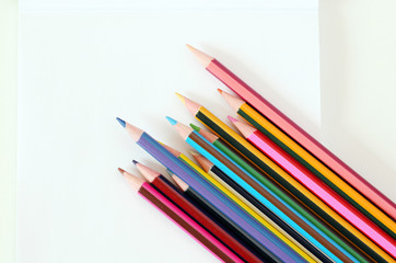 back to school: school supplies, isolated pencils, pens and notepad 