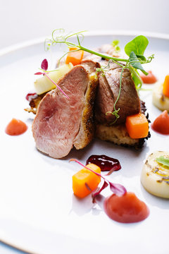 Roast duck with charred leeks,carrots,tayberry jelly,rhubarb puree and potato rosti