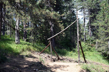 Fototapeta na wymiar Obstacles for crossing and training in the forest