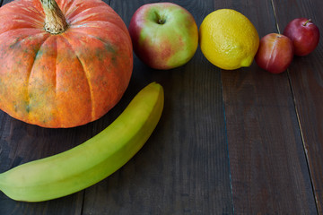 Fruit and Berry Raw Eating. Vegetarian food concept. Dark Background.