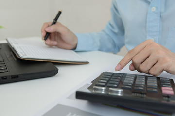 Businessman calculate about cost and doing finance at home office, Finance managers task, Concept business and finance investment