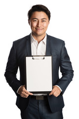 Handsome smiling businessman in a blue suit and white shirt, holding a clipboard with a blank paper. Standing in front of a white background.