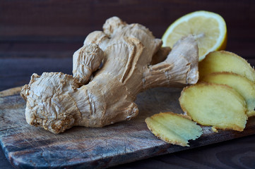 Ginger roots on wooden background (Zingiber officinale)