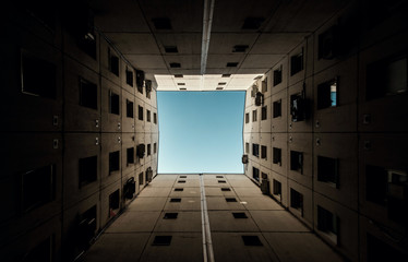 Minimalist architecture building in perspective with sky in center.
