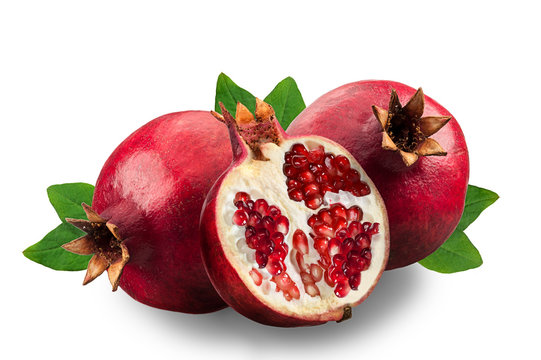 Image of ripe pomegranates and leaves isolated on a white background