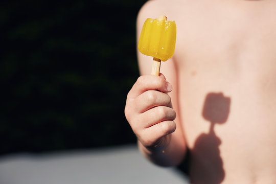 Child holding popsicle