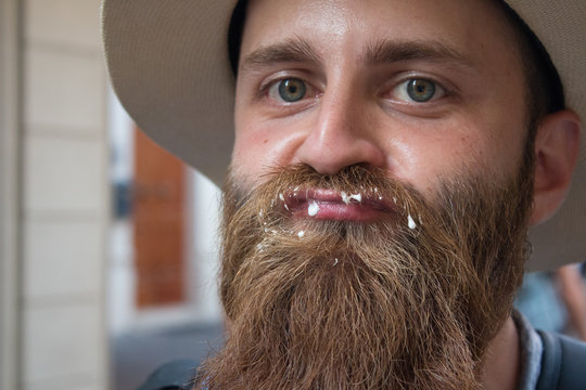 Expressive man eating ice-cream