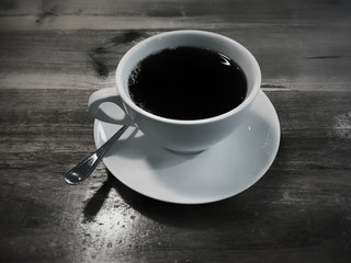 White coffee cup with fresh hot black coffee