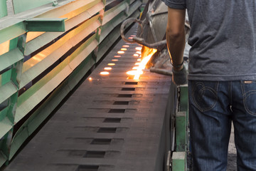 Iron molten metal is poured in sand mold