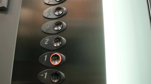 Pushing the elevator button labeled with the number one