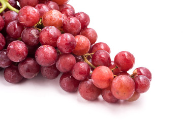Red grapes on a white background.