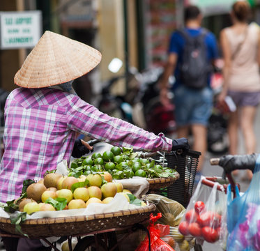 HANOI, VIETNAM - AUGST 2017:  Street vendors selling their goods in Hanoi, Vietnam