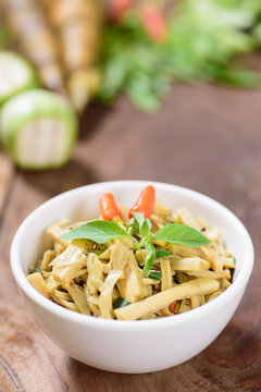 Thai Northern food (Yum Nor Mai),spicy bamboo shoot salad with crab paste on wooden background