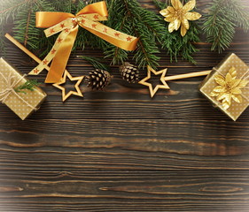 Christmas or New Year dark wooden background, Xmas framed with fir branches, season decorations and gifts, space for a text. Top view. Copy space.Flat lay