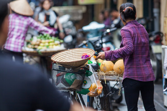 HANOI, VIETNAM - AUGST 2017:  Street vendors selling their goods in Hanoi, Vietnam