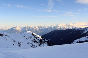 Mountain panorama with snow and snowshoe trail in winter in Stubai Alps, Austria