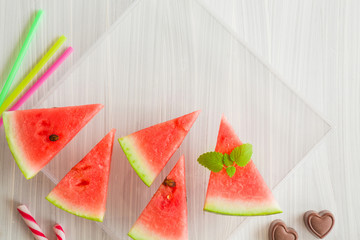 Slices of watermelon. Sweet, juicy treats on the table. Healthy eating and lifestyle. Food concept. Top view.