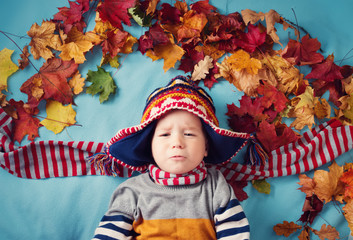 two years old boy dreaming in autumn