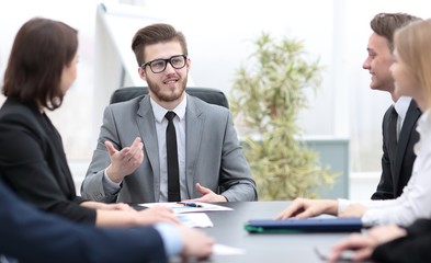 businessman at a meeting with employees