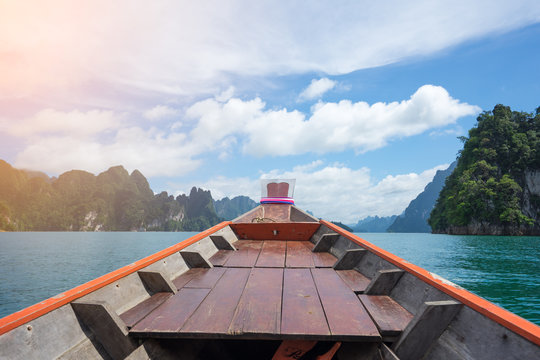 Boat tail to sail see scenic and unique landscape with floating houses and long tail boats at Chieou Laan lake, Thailand