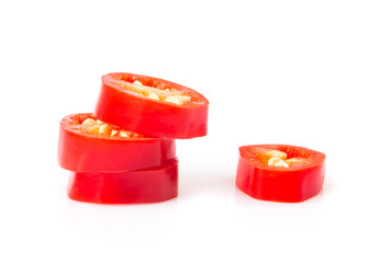 Closeup top view red chili pepper with sliced on white background, raw food ingredient concept