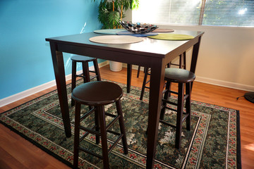 modern dining room with table and stools