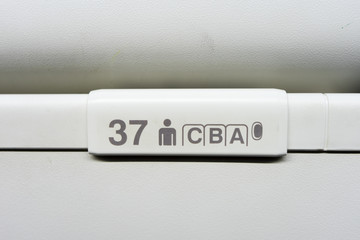 seat numbers on Luggage shells inside the passenger airplane