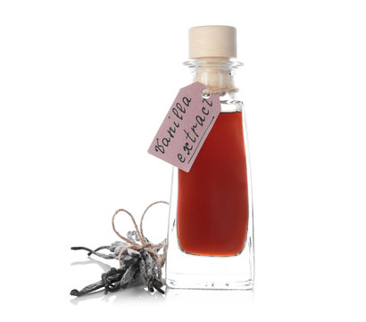 Bottle with vanilla extract and sticks on white background