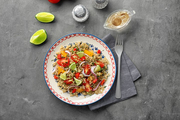 Salad with quinoa, tomatoes and onion served on plate