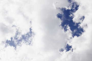 cumulus white clouds against a beautiful blue sky, bizarre patte