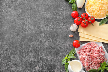 Ingredients for cooking meat lasagna on table, top view