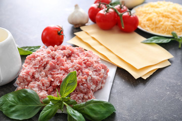 Ingredients for cooking meat lasagna on table