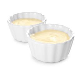 Vanilla pudding in ceramic bowls isolated on white