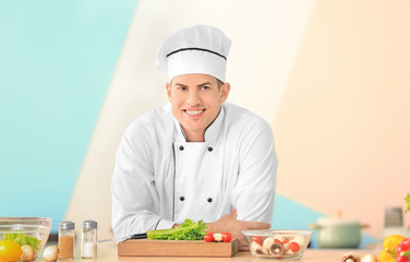 Young male chef in kitchen