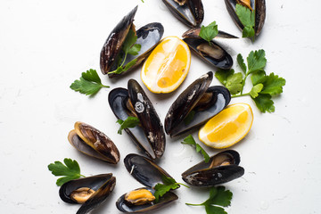 Boiled mussels on white background.