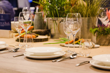 Table setting decor with cutlery, plates and glasses