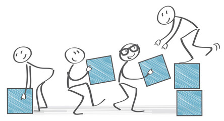 Team stapelt gemeinsam Kisten - Teamwork