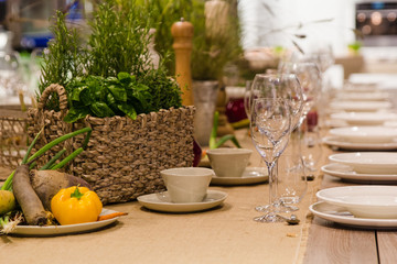 Table setting decor with cutlery, plates and glasses