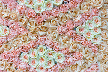 Rose fake flower and Floral background. rose flowers made of fabric. The fabric flowers bouquet. Colorful of decoration artificial flower
