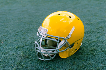Stadium grass with football helmet on it