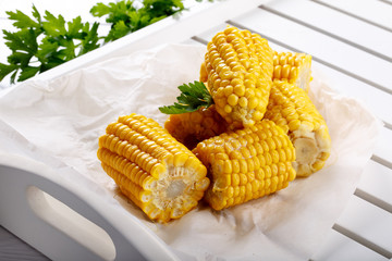 Boiled sweet corn cob with butter and salt