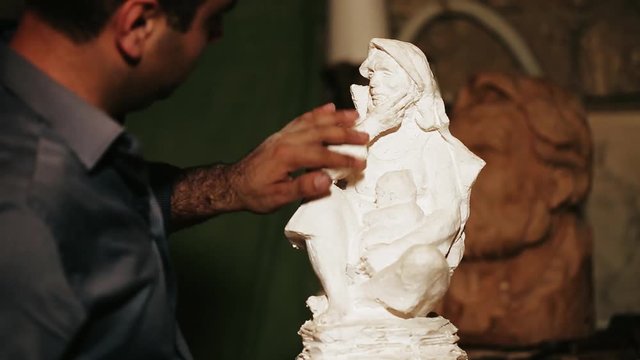 Sculptor work with gypsum