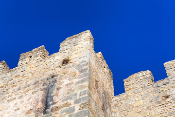 Stone wall and blue sky , background