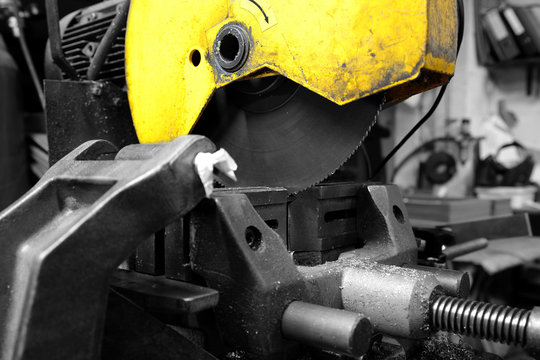 Industrial Circular Saw Machine In A Workshop With Selective Colour