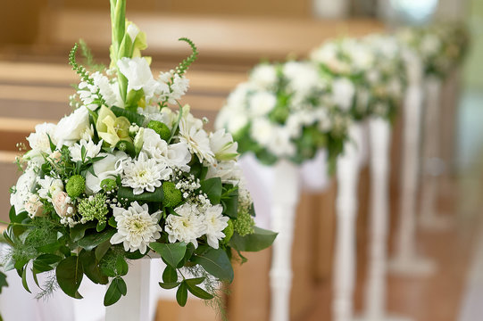 beautiful decor of white flowers in church for a wedding ceremony