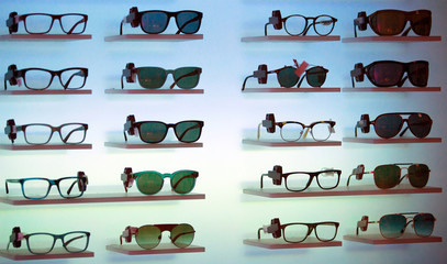 Optical store, eyeglasses on blue background