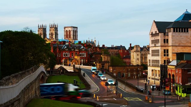 York, UK. Sundown time-lapse of central York, UK, with York Minster cathedral on the back with cloudy sky.