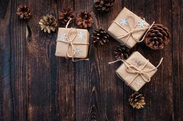 gift christmas boxes on a wooden background