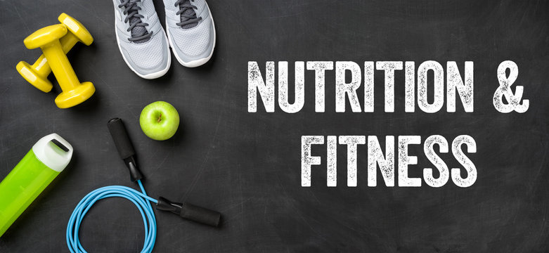Fitness equipment on a dark background - Nutrition and Fitness